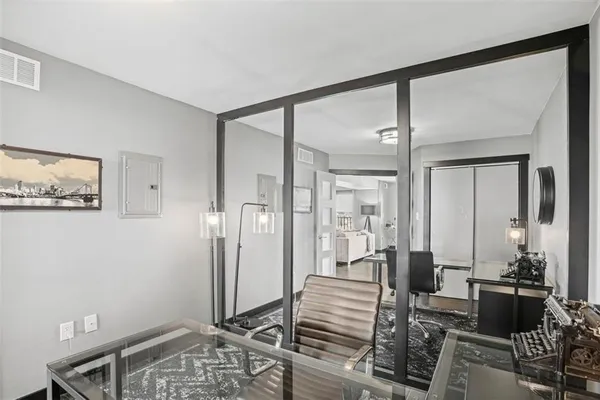 a view of a livingroom with furniture and windows