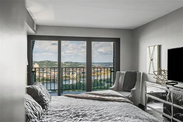 a bedroom with furniture and a window