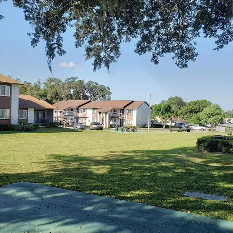 a view of a lake with a house in the background