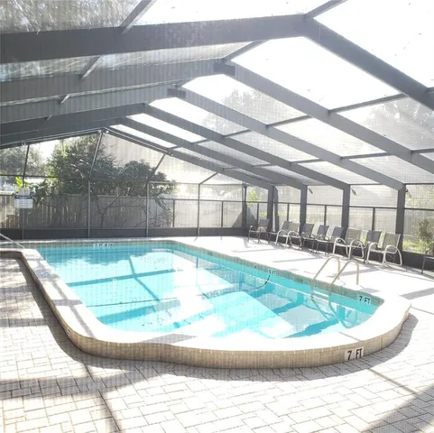 a view of a swimming pool with a patio