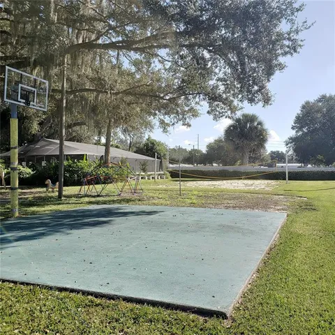 a view of a yard with a swimming pool