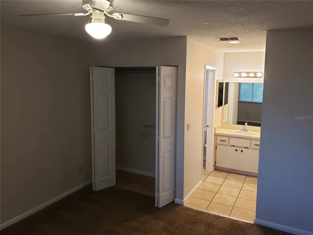 a room with a white cabinets and sink