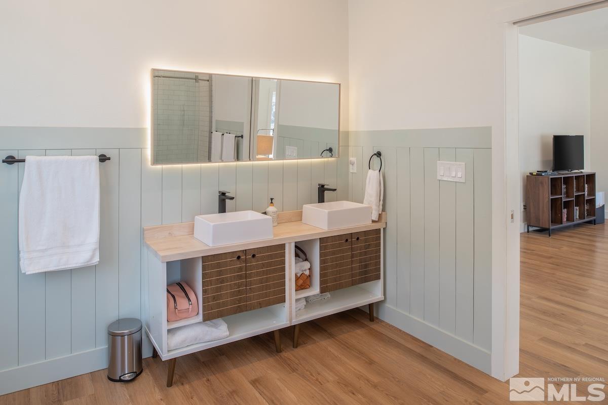 4600 Tybo Road Reno, NV 89521 - Photo 24 of 40 a bathroom with a sink a mirror and a shower