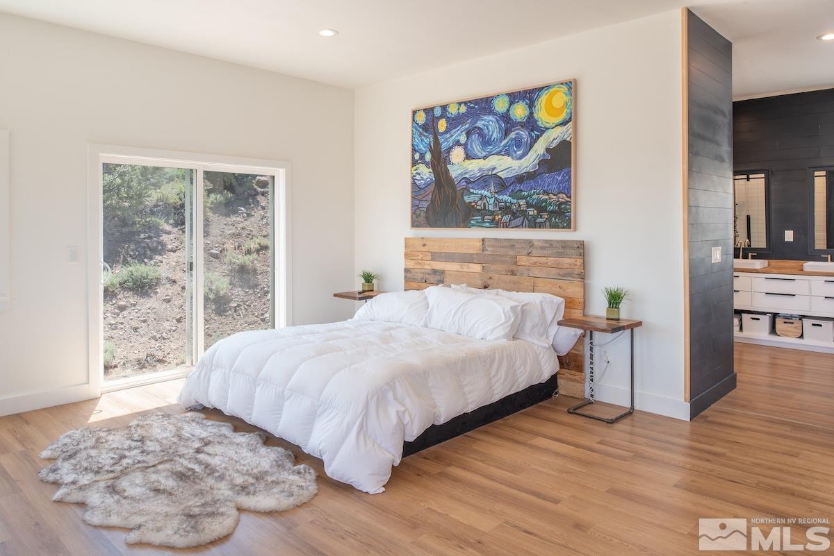 4600 Tybo Road Reno, NV 89521 - Photo 5 of 40 a bed sitting in a spacious bedroom next to a window