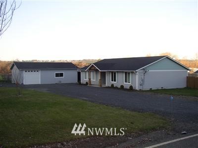 275 Rogers Road Chehalis, WA 98532 - Photo 1 of 1 a front view of a house with a garden