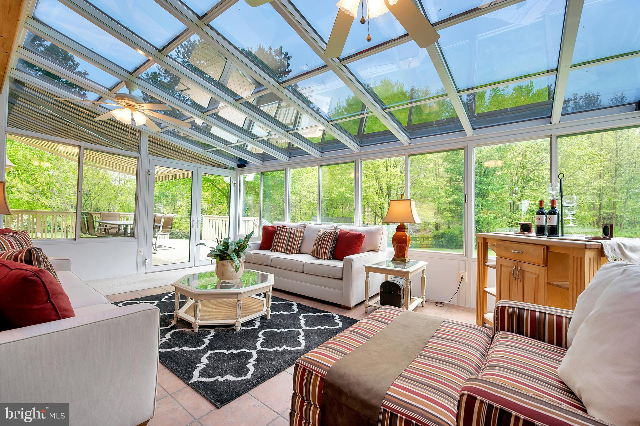 29 Riva Ridge Lane Bear, DE 19701 - Photo 26 of 48 Sunroom with ceiling fans and heating and air cond