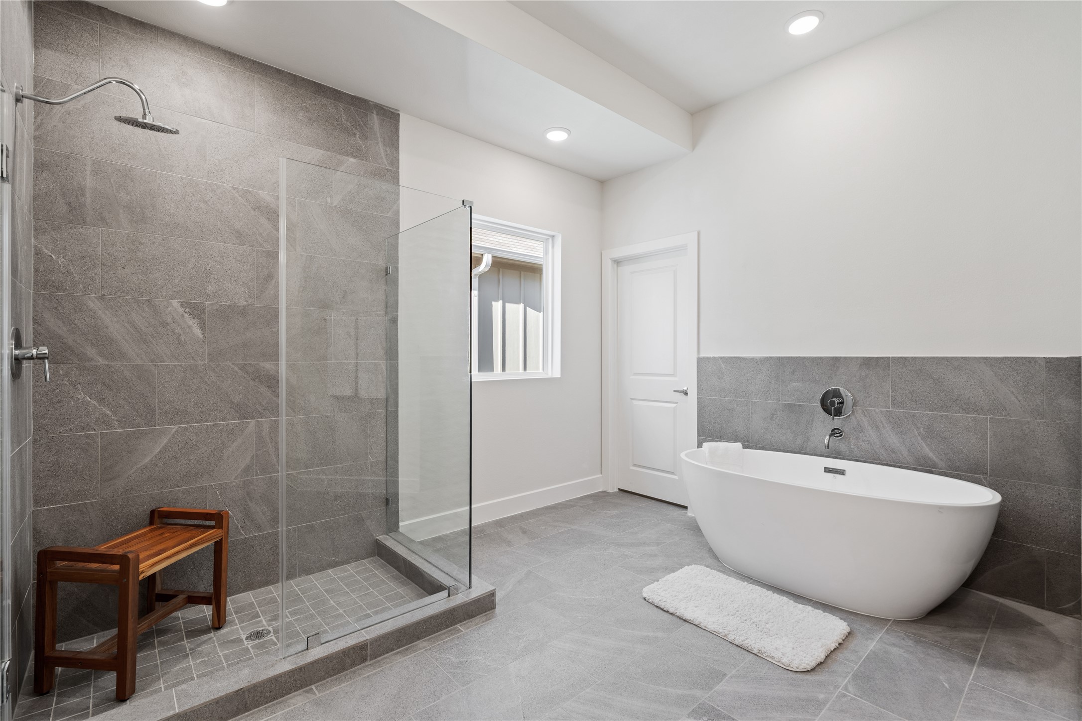 6505 Rena Street Houston, TX 77092 - Photo 19 of 28 The primary bath pairs a freestanding soaking tub with a glass-enclosed shower, giving you both without having to choose.