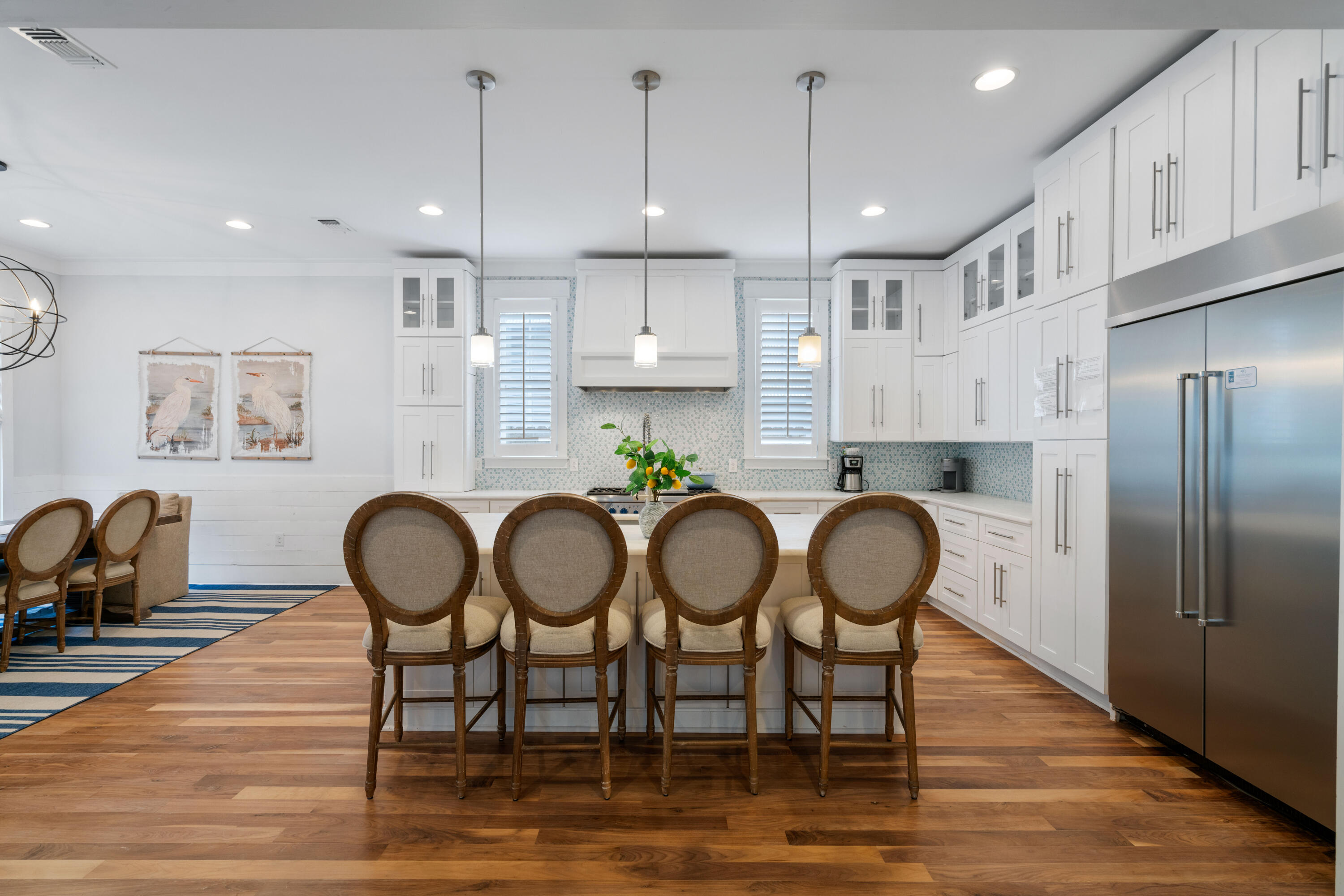 26 Dothan Avenue Santa Rosa Beach, FL 32459 - Photo 11 of 63 a kitchen with granite countertop a dining table chairs stainless steel appliances and cabinets