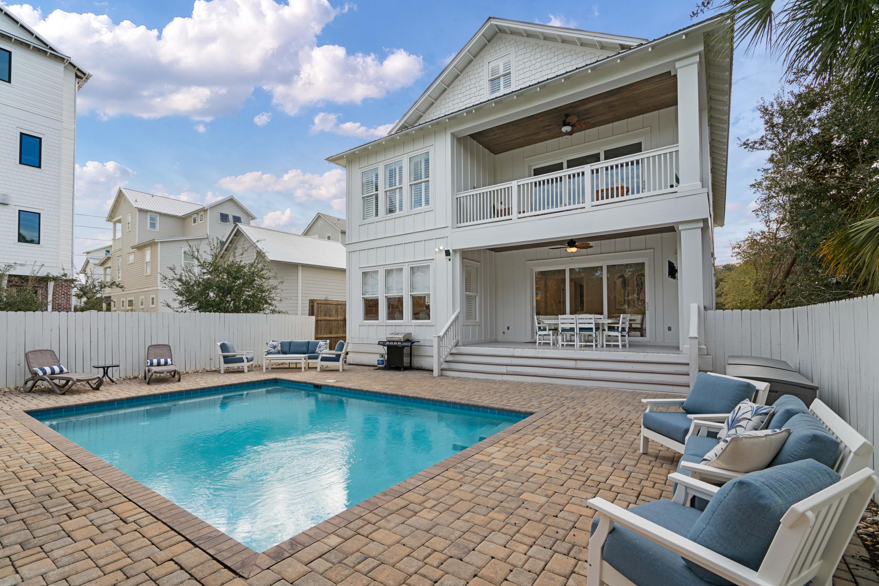 26 Dothan Avenue Santa Rosa Beach, FL 32459 - Photo 17 of 63 a view of a patio with swimming pool table and chairs