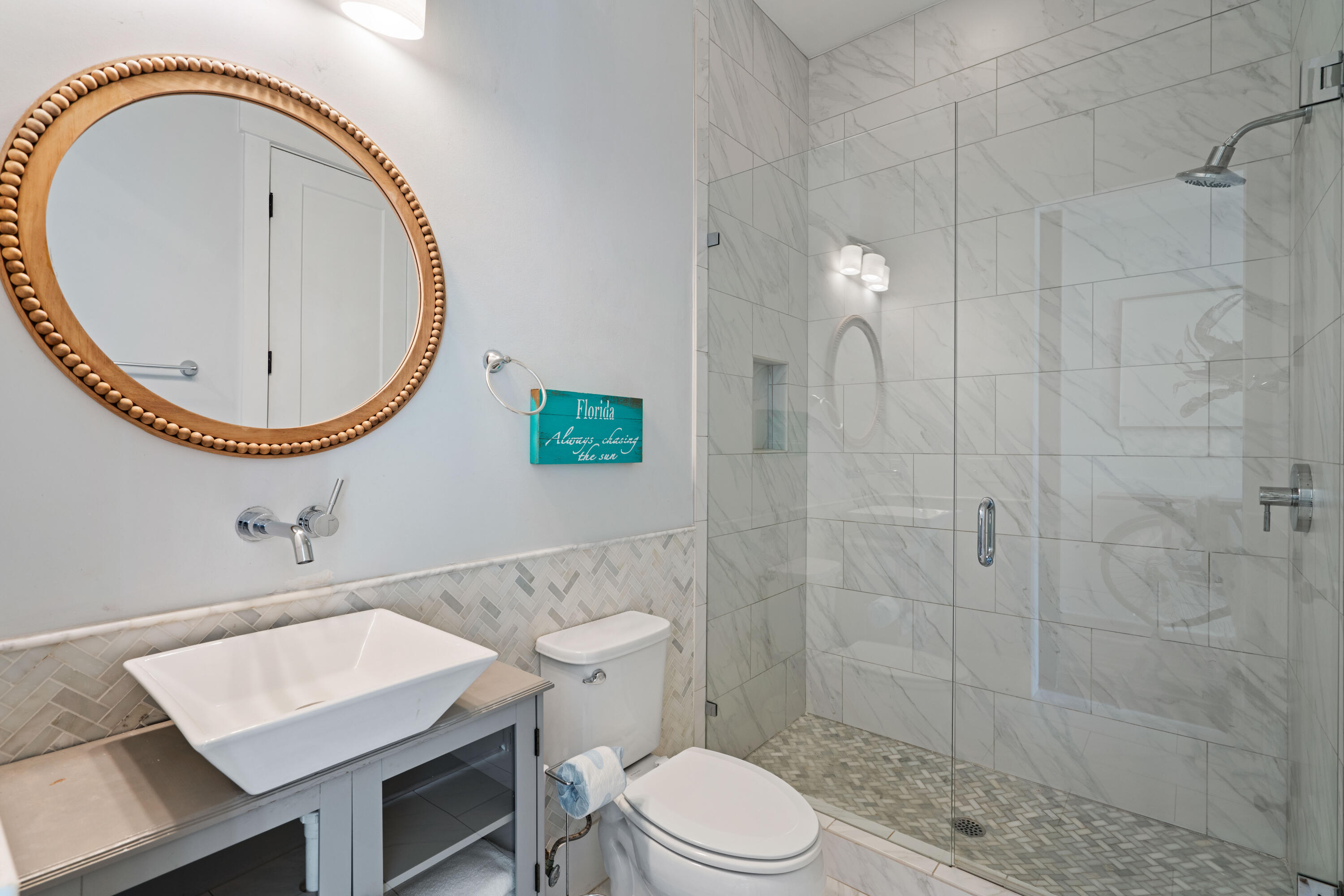 26 Dothan Avenue Santa Rosa Beach, FL 32459 - Photo 31 of 63 a bathroom with a toilet a sink and mirror