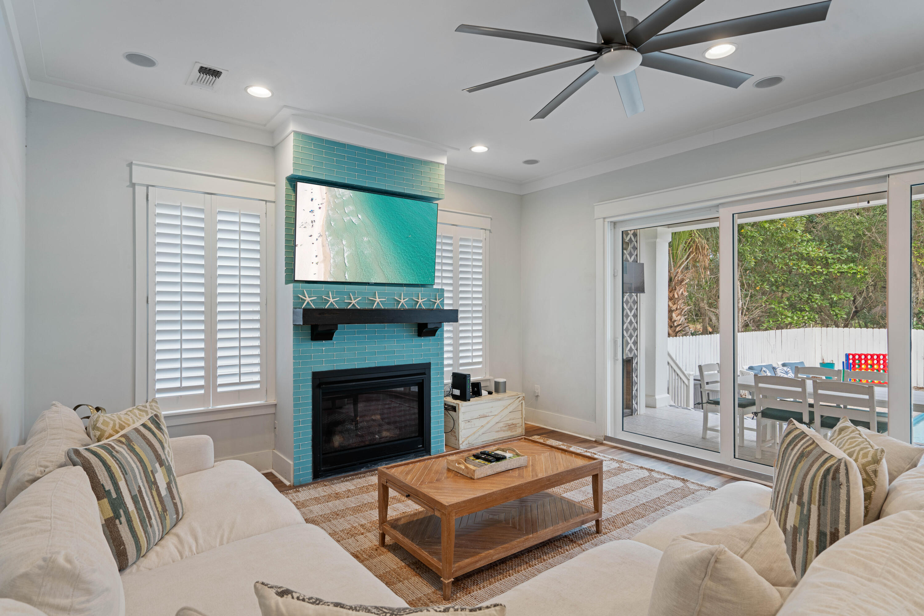 26 Dothan Avenue Santa Rosa Beach, FL 32459 - Photo 4 of 63 a living room with furniture a large window and a fireplace