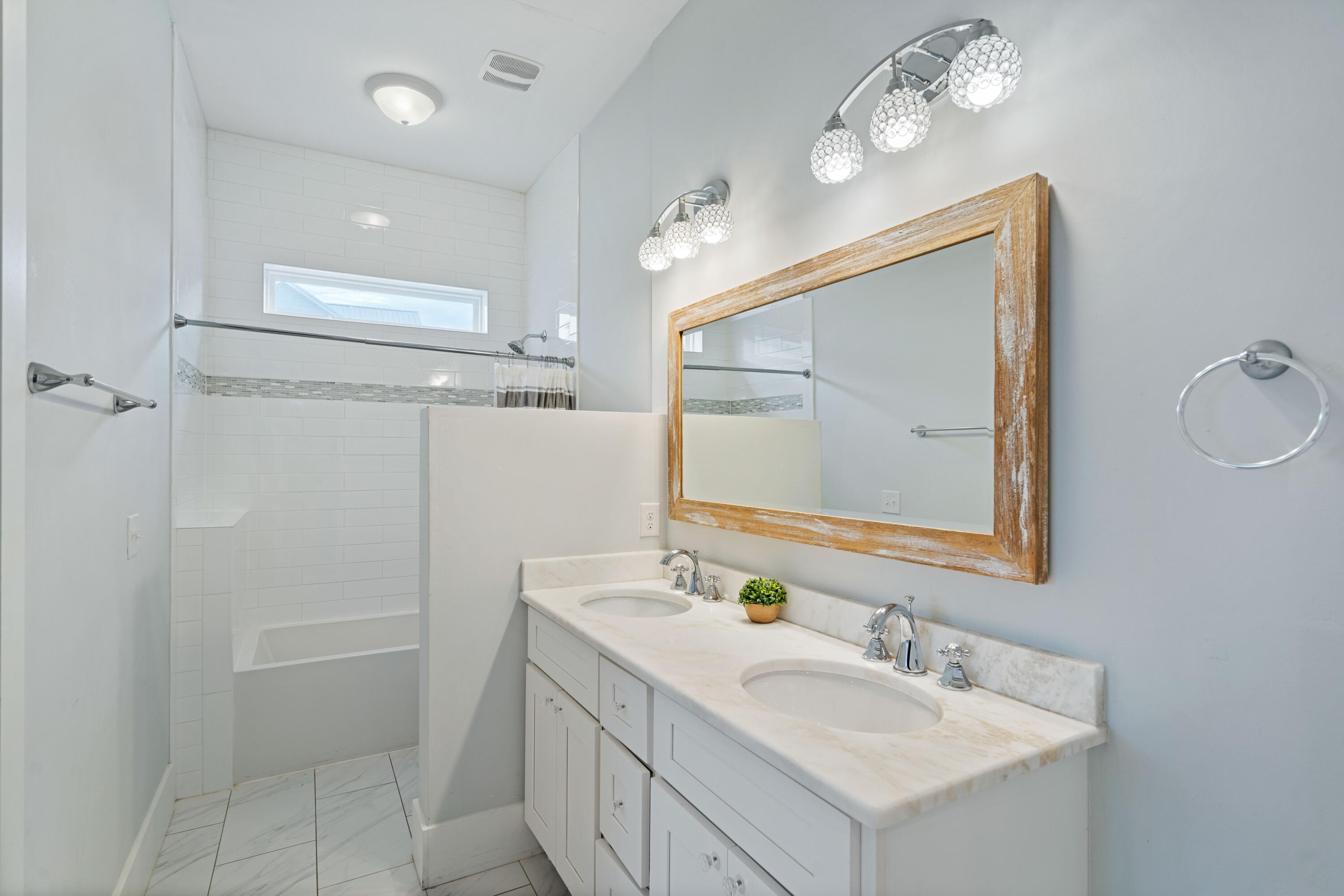 26 Dothan Avenue Santa Rosa Beach, FL 32459 - Photo 52 of 63 a bathroom with a sink vanity granite tub shower and a mirror
