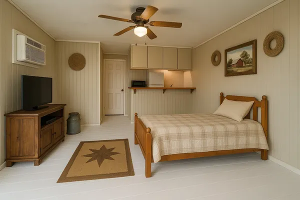 a bed room with a bed and a flat screen tv