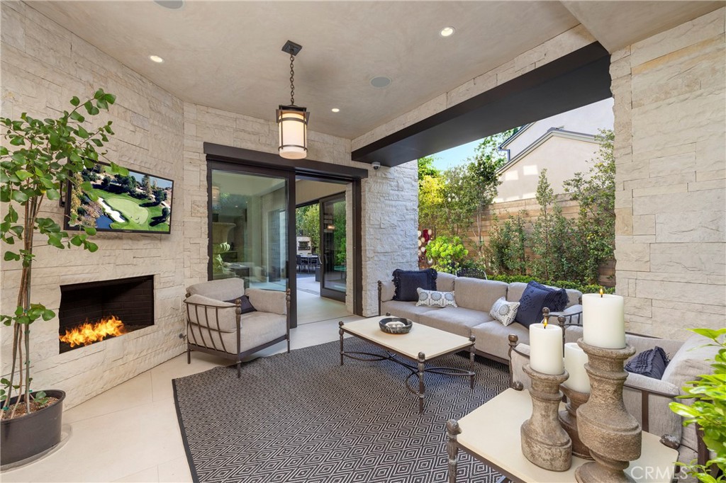 401 Snug Harbor Road Newport Beach, CA 92663 - Photo 14 of 35 a living room with patio fireplace furniture and a fireplace