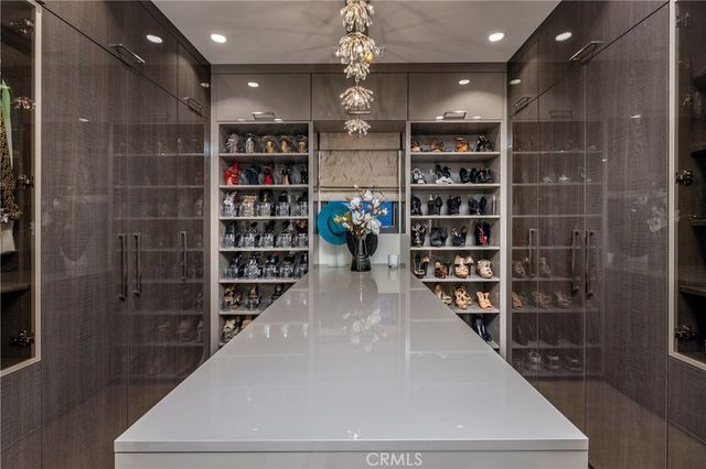 a view of a hallway with wooden shelves