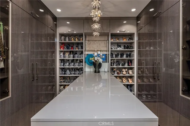 a view of a hallway with wooden shelves