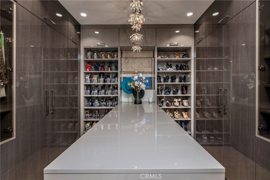 401 Snug Harbor Road Newport Beach, CA 92663 - Photo 19 of 35 a view of a hallway with wooden shelves