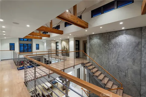a view of a living room and a kitchen with furniture