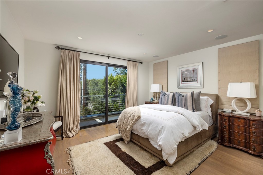 401 Snug Harbor Road Newport Beach, CA 92663 - Photo 26 of 35 a bedroom with a bed table and window