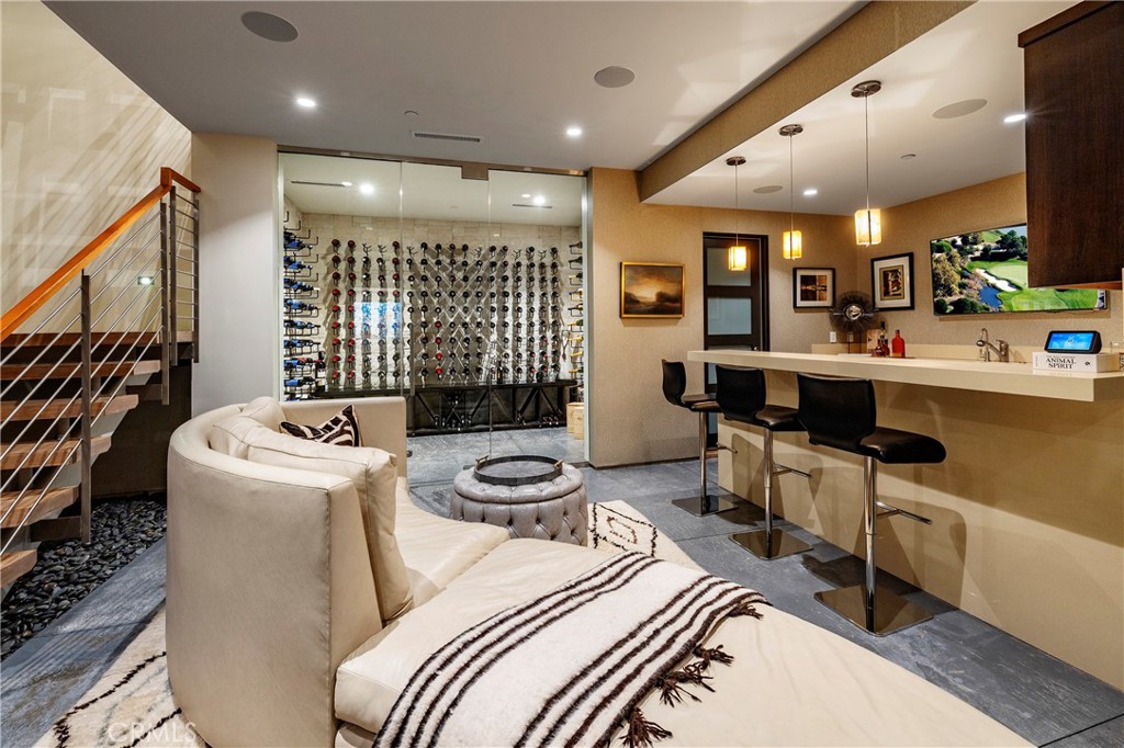 401 Snug Harbor Road Newport Beach, CA 92663 - Photo 31 of 35 a room with furniture a flat screen tv and a large window