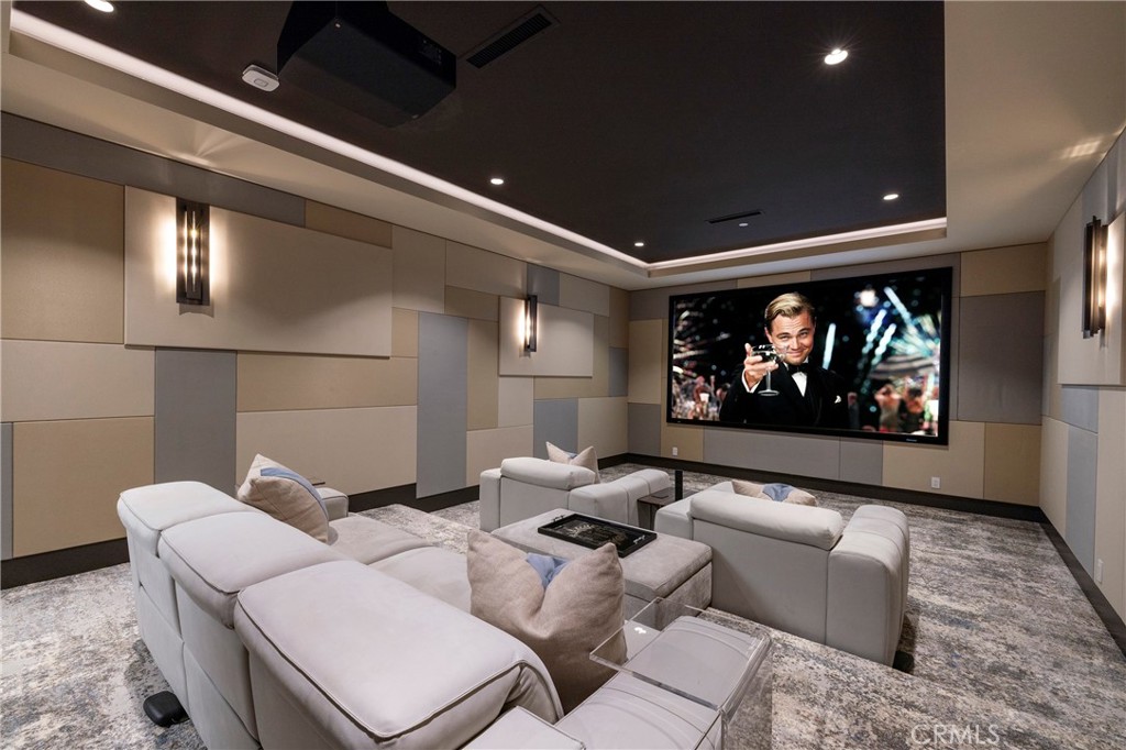 401 Snug Harbor Road Newport Beach, CA 92663 - Photo 32 of 35 a living room with furniture a rug and a projector