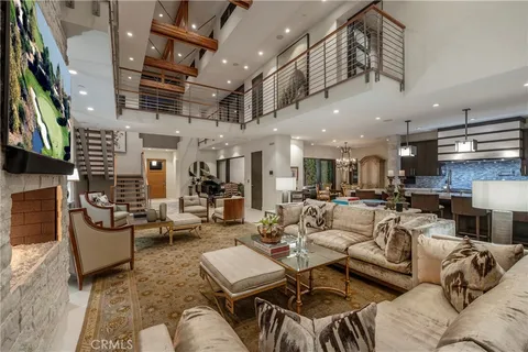 a living room with lots of furniture and a flat screen tv