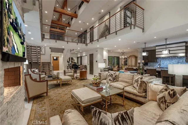 a living room with lots of furniture and a flat screen tv