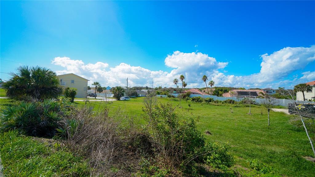 4736 South Atlantic Avenue Ponce Inlet, FL 32127 - Photo 26 of 32 a view of a building in the middle of a field