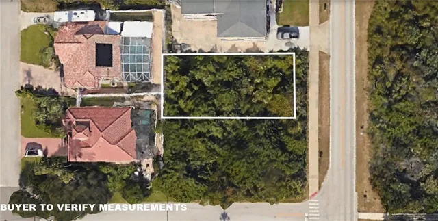 a view of a house with a backyard and a garden