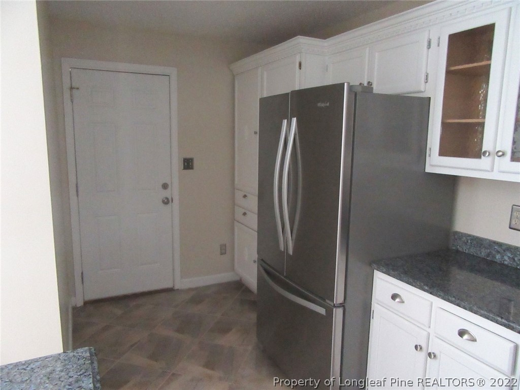 461 Camden Road Raeford, NC 28376 - Photo 8 of 18 a metallic refrigerator freezer sitting in a kitchen