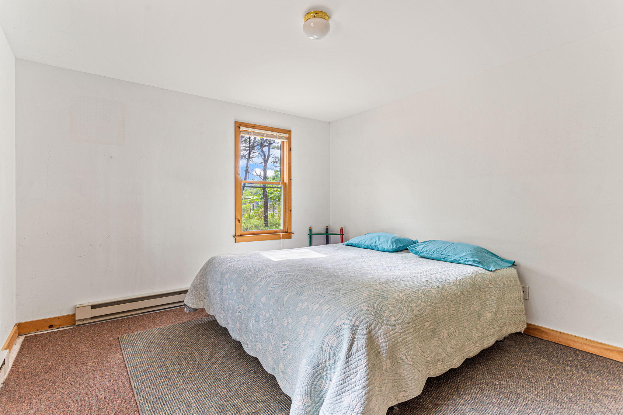 135 Daniels Drive Wellfleet, MA 02667 - Photo 12 of 21 a bedroom with a bed and a window