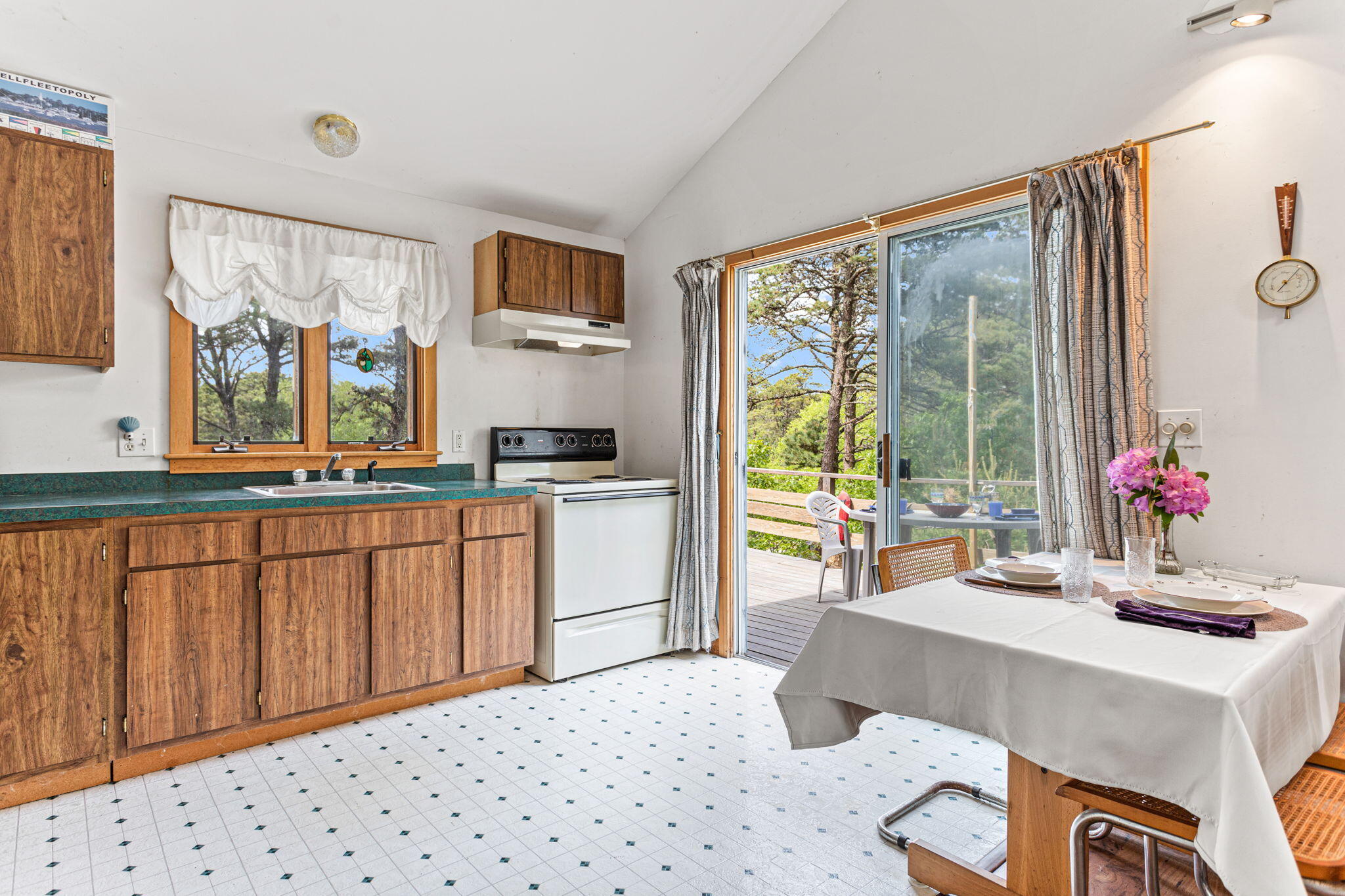 135 Daniels Drive Wellfleet, MA 02667 - Photo 7 of 21 dining kitchen to slider and deck