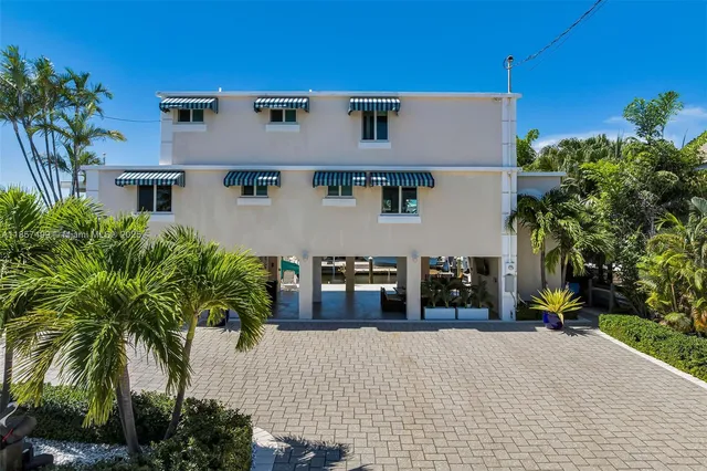 front view of house with potted plants