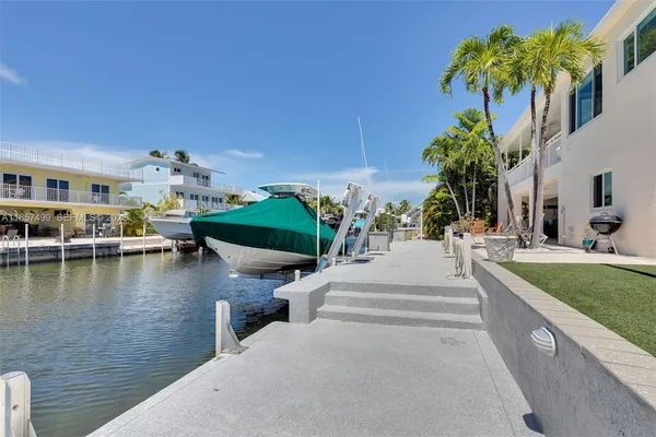 a kitchen with stainless steel appliances cabinets and a window