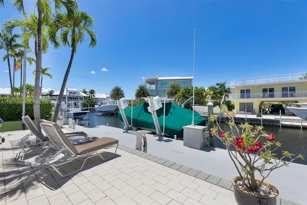a living room with furniture a rug and a fireplace