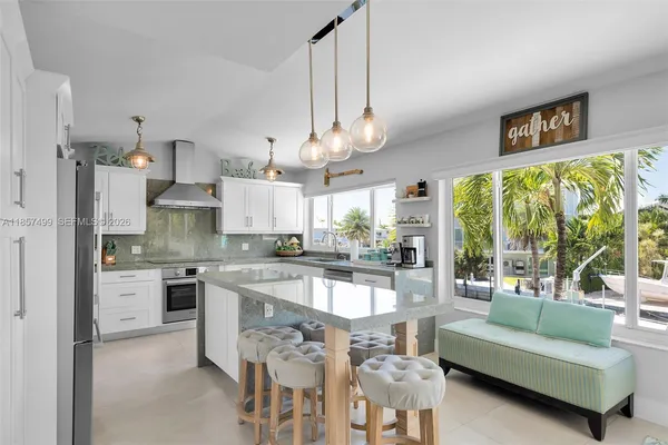 a spacious bedroom with a bed and a flat screen tv