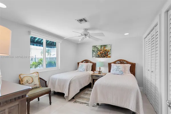 a front view of a house with a yard and a garage