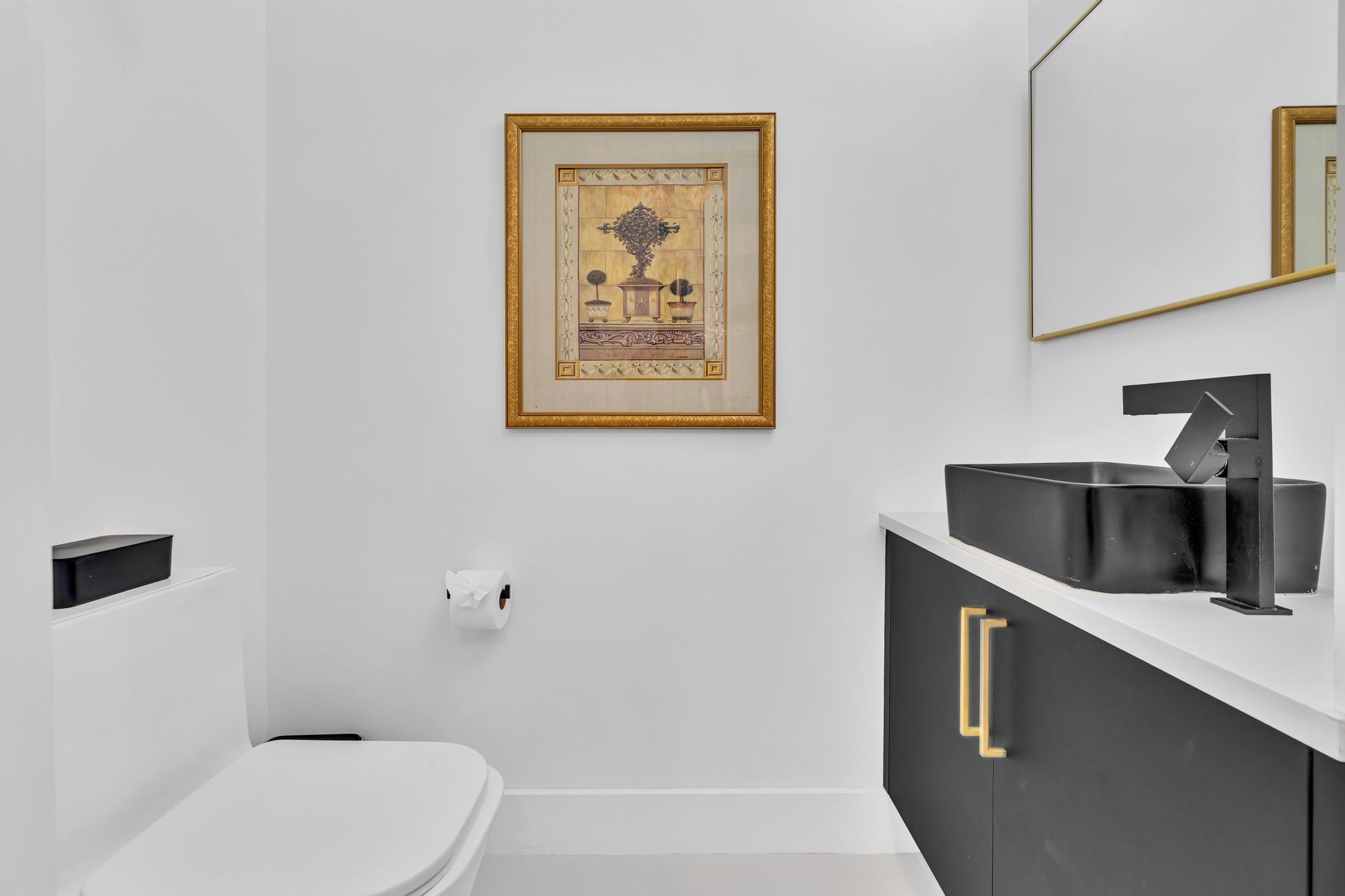701 East Camino Real, Unit 12G Boca Raton, FL 33432 - Photo 24 of 82 a bathroom with a toilet a sink and bathtub