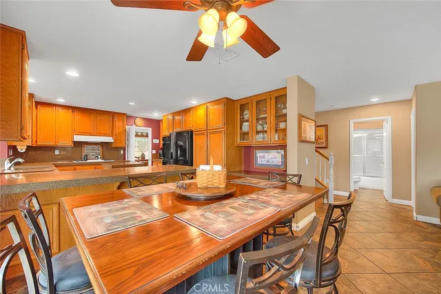 a living room with furniture a rug and a chandelier