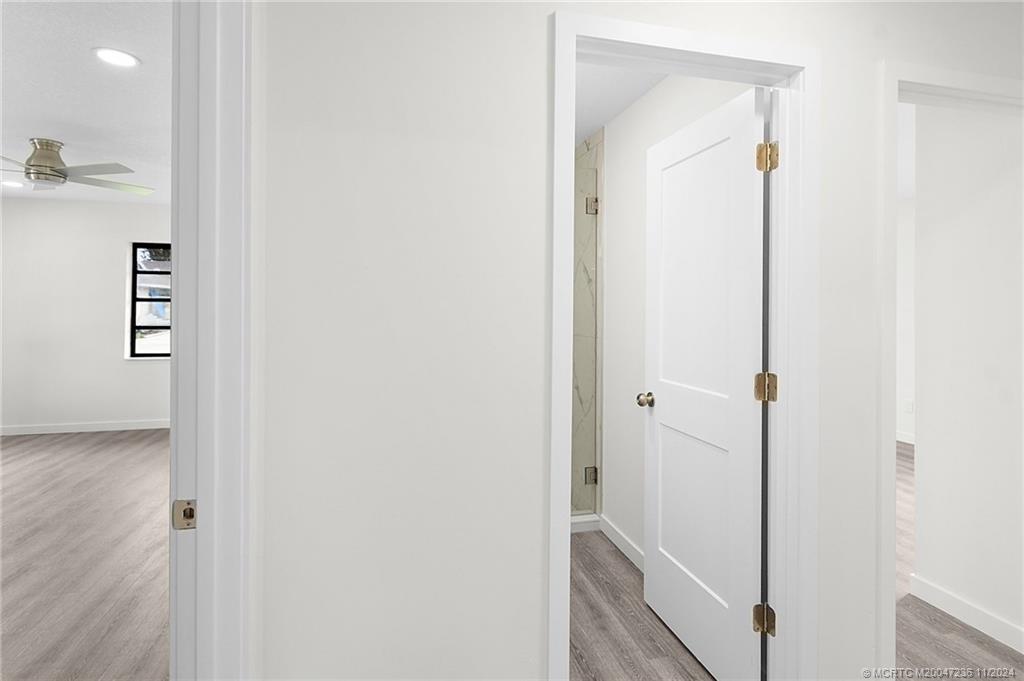 5635 Southeast Miles Grant Road Stuart, FL 34997 - Photo 22 of 73 a view of a hallway with closet