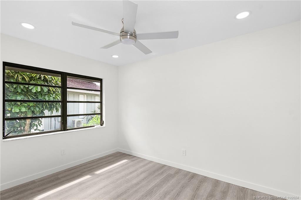 5635 Southeast Miles Grant Road Stuart, FL 34997 - Photo 26 of 73 an empty room with a window