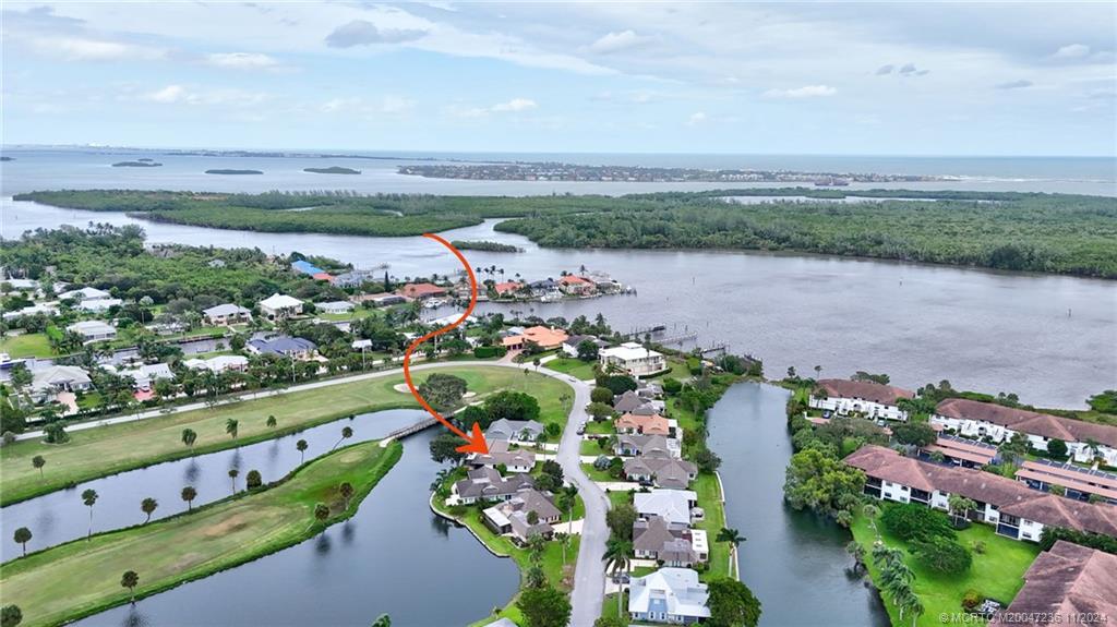 5635 Southeast Miles Grant Road Stuart, FL 34997 - Photo 3 of 73 a view of a city with an ocean