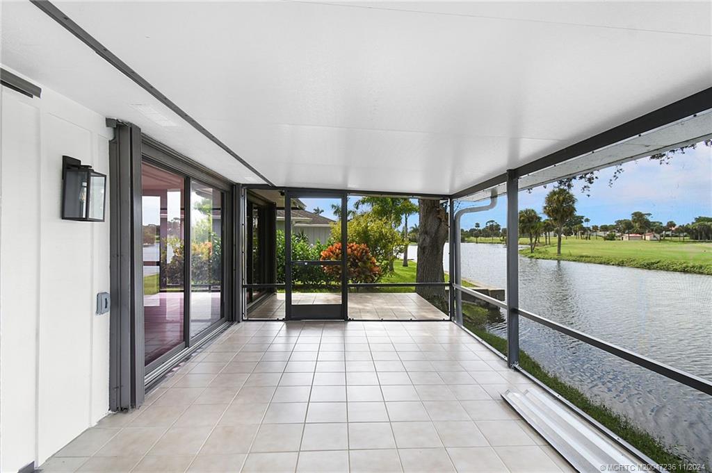 5635 Southeast Miles Grant Road Stuart, FL 34997 - Photo 40 of 73 a lobby with furniture and large windows