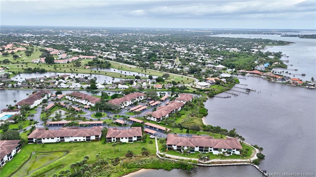 5635 Southeast Miles Grant Road Stuart, FL 34997 - Photo 52 of 73 an aerial view of a city with lots of residential buildings