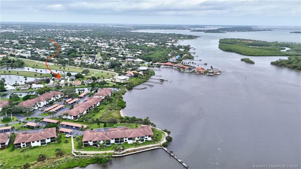 5635 Southeast Miles Grant Road Stuart, FL 34997 - Photo 53 of 73 an aerial view of a houses with outdoor space