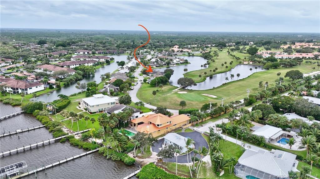 5635 Southeast Miles Grant Road Stuart, FL 34997 - Photo 58 of 73 an aerial view of a city with lots of residential buildings