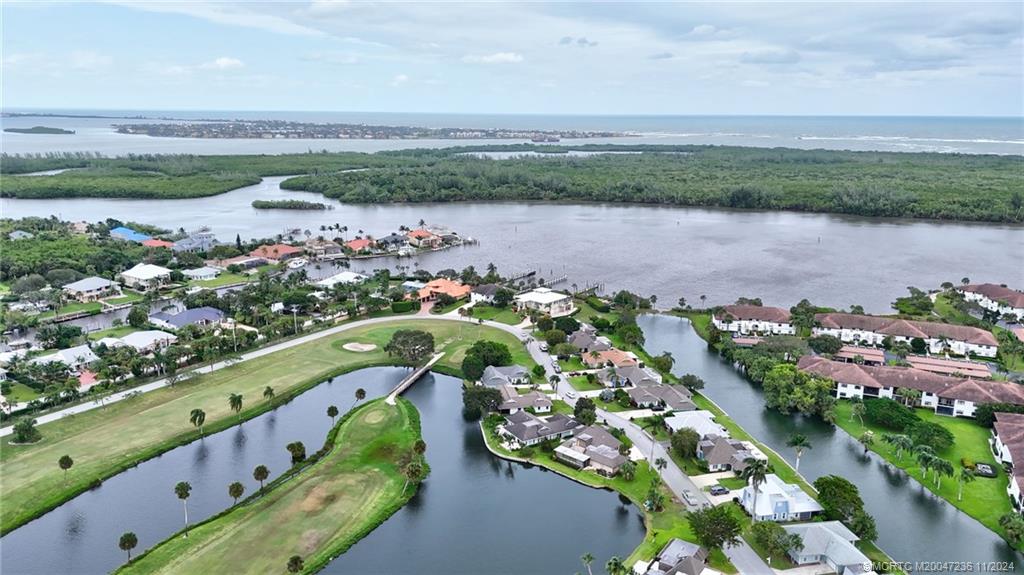 5635 Southeast Miles Grant Road Stuart, FL 34997 - Photo 64 of 73 a view of lake with outdoor space