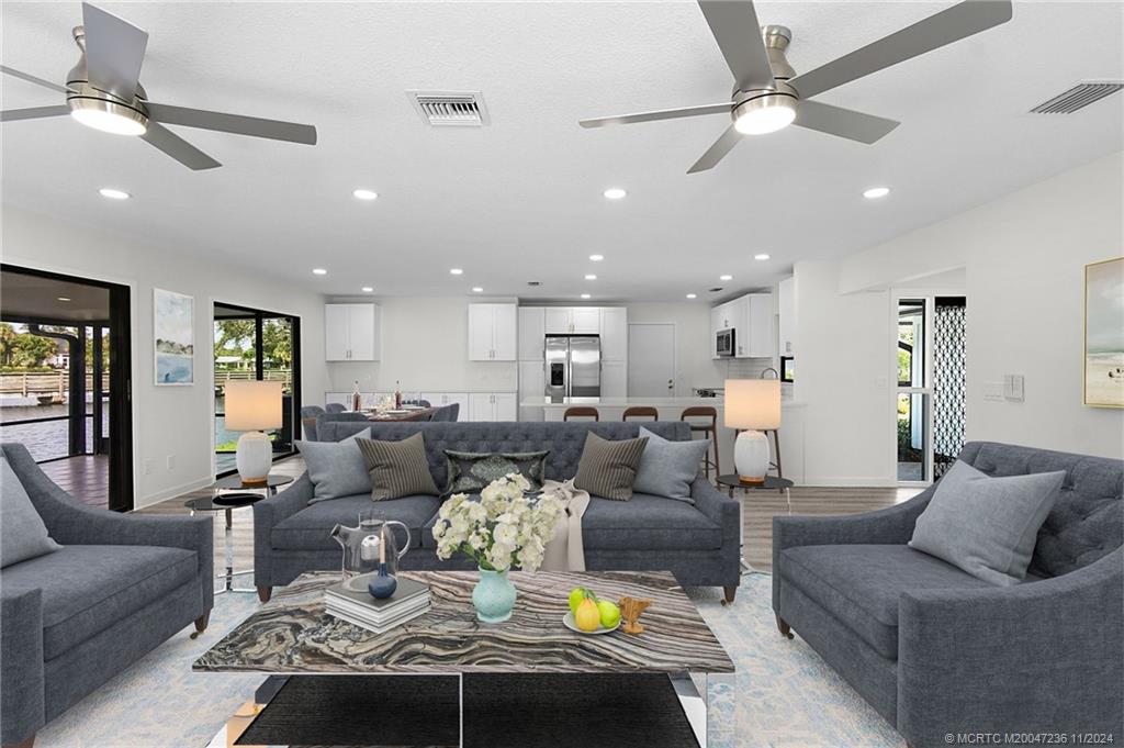 5635 Southeast Miles Grant Road Stuart, FL 34997 - Photo 8 of 73 a living room with furniture