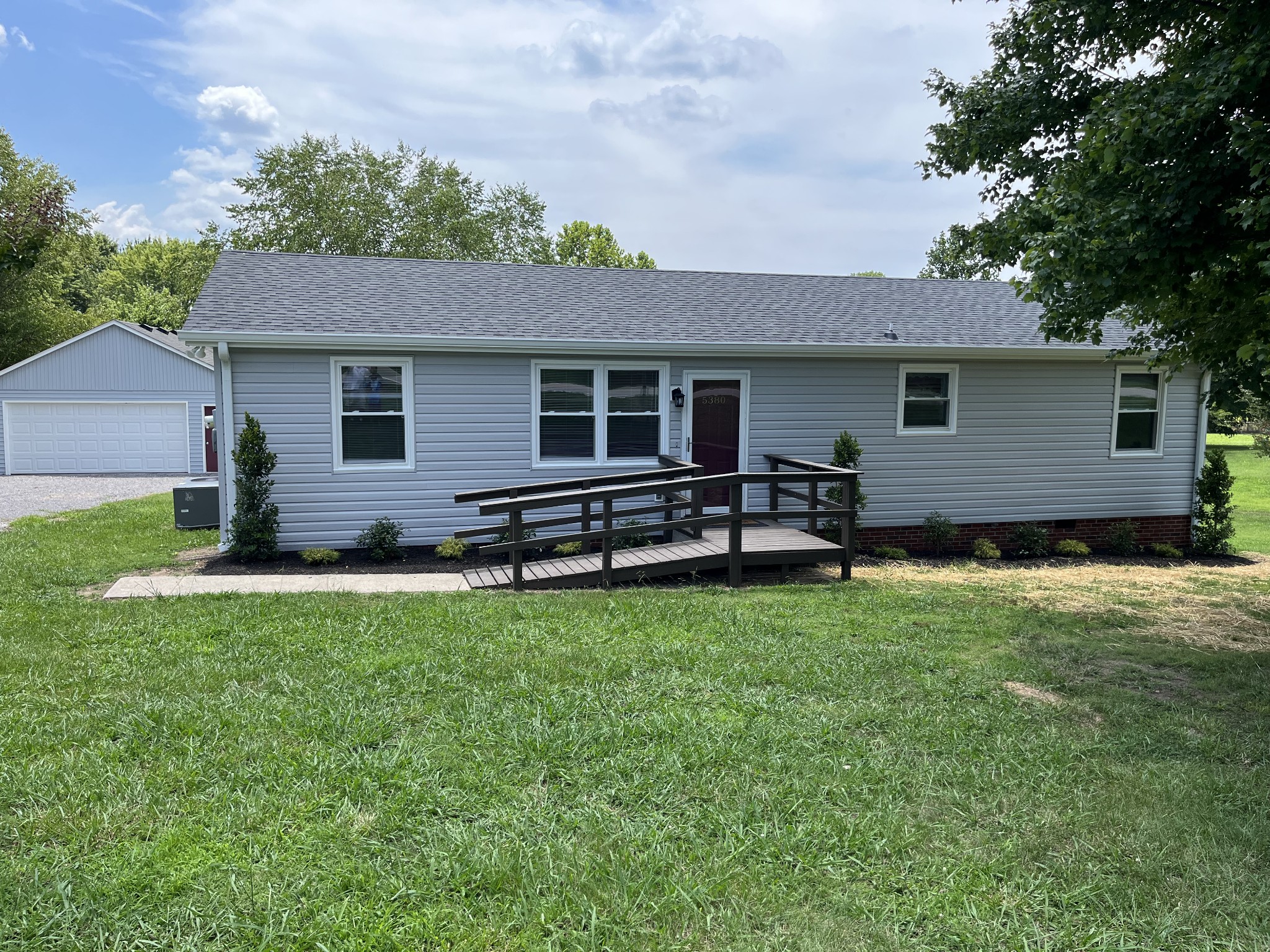 5380 Chicken Road Lebanon, TN 37090 - Photo 1 of 17 a backyard of a house with table and chairs