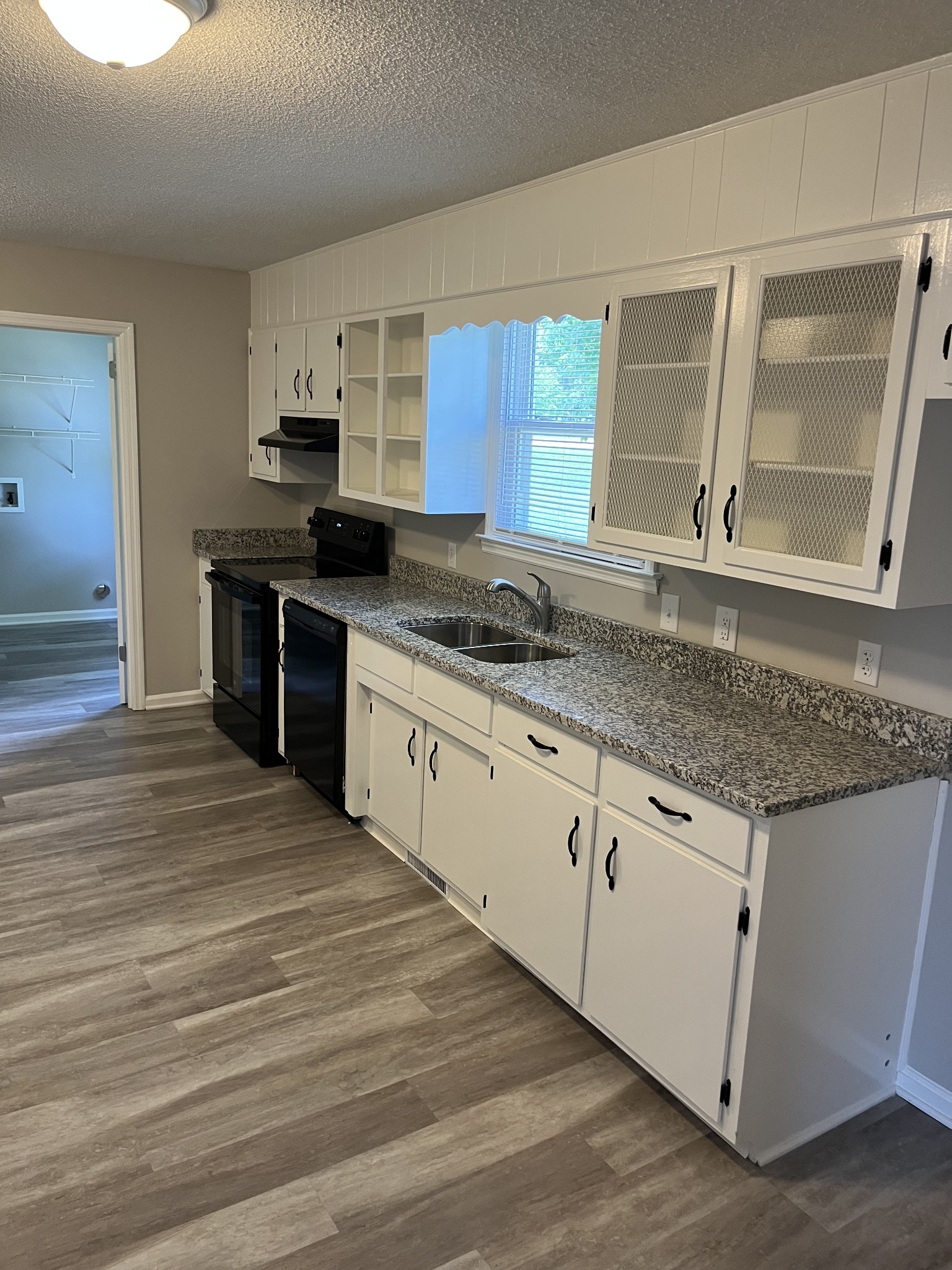 5380 Chicken Road Lebanon, TN 37090 - Photo 11 of 17 a kitchen with granite countertop a sink and cabinets